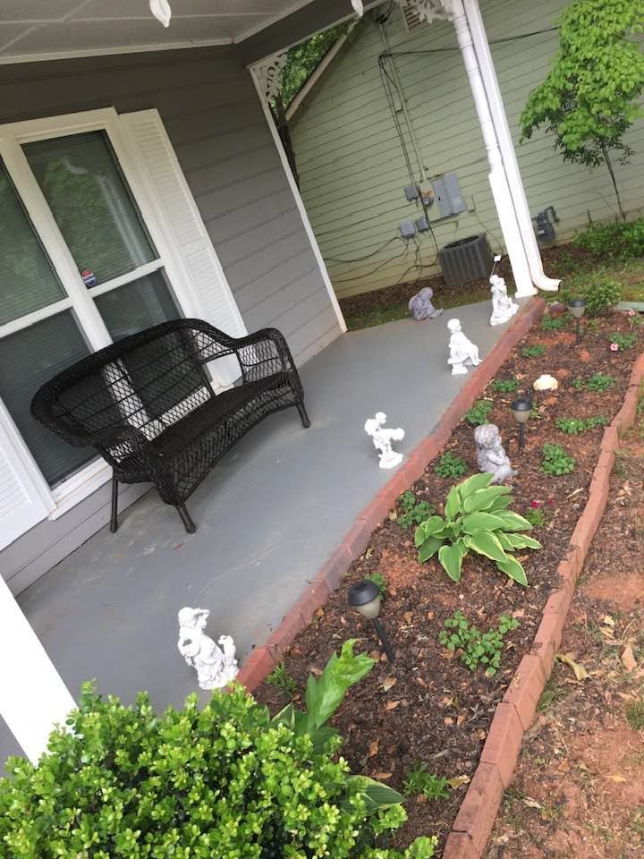 Front porch without railing — open concrete porch with garden bed, Metro Atlanta, GA