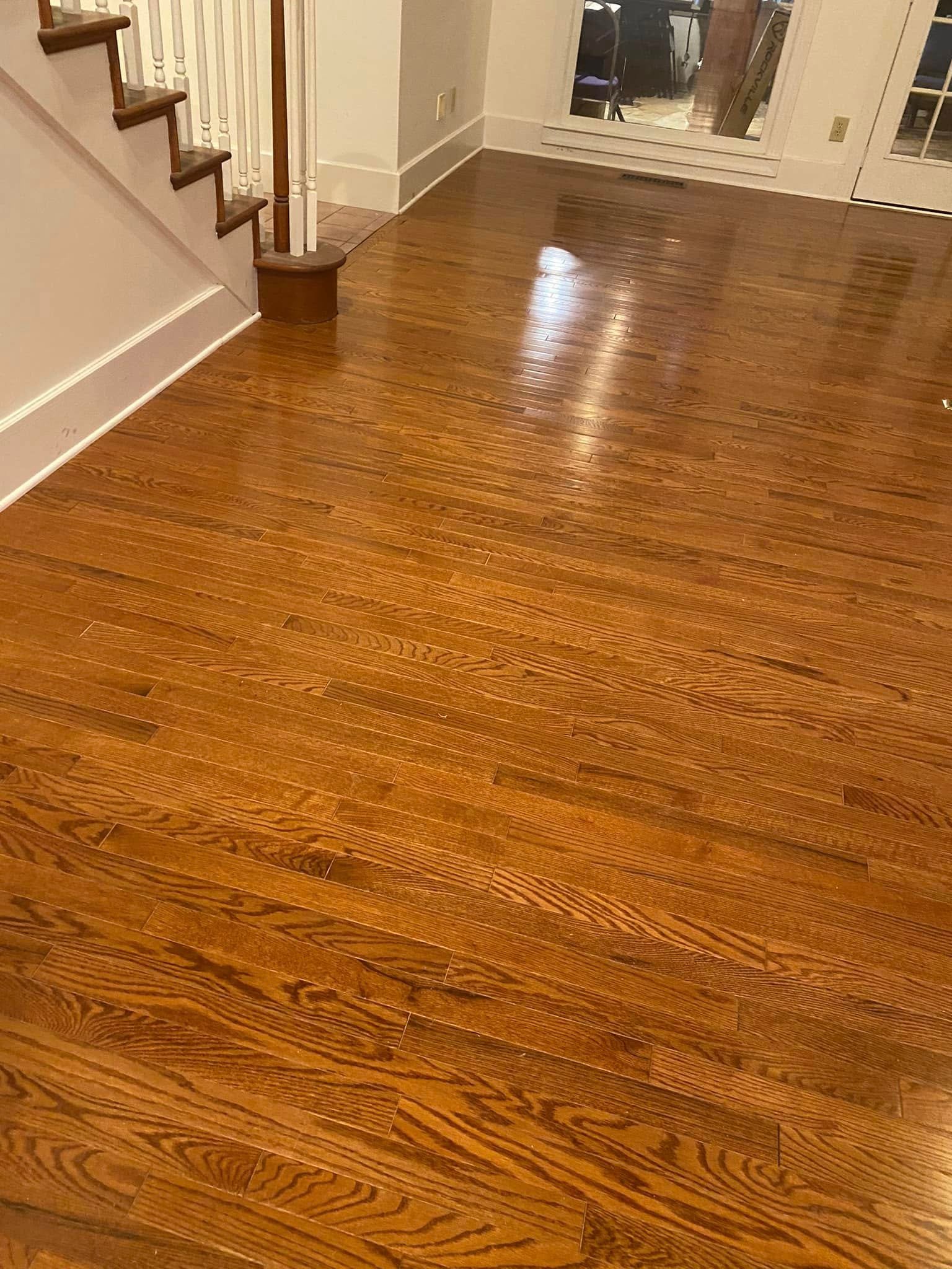 Completed golden oak hardwood floor fully installed and finished with warm stain — Metro Atlanta, GA