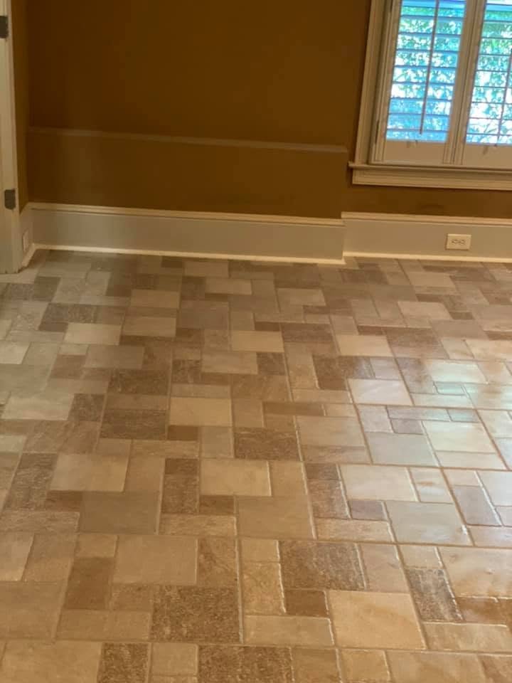 Warm travertine tile in a Versailles mixed-size pattern fully installed across a room floor — Metro Atlanta, GA